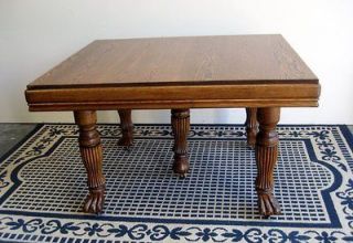 Antique Oak Dining Table with 4 internal leaves and claw feet Circa 