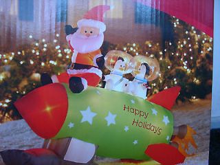 LONG AIRBLOWN INFLATABLE SANTA & PENGUINS ON A ROCKET SHIP (LIGHTED 