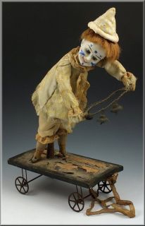   Automaton Pull Toy Bisque Head Clown on Cart w/ Paperweight Eyes