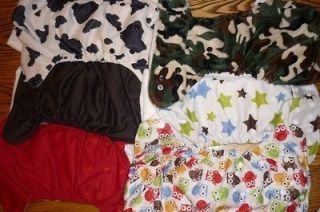 Lot of 6 used Blueberry diapers. 5 are one size deluxe and 1 minky 