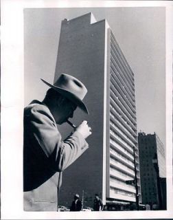 1954 Houston Texas a Man in 10 Gallon Hat Light a Pipe in Modern City 