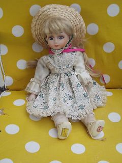   BRINNS COLLECTIBLE PORCELAIN MUSICAL DOLL , PLAYS ITS A SMALL WORLD