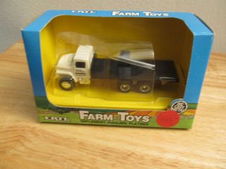 Ertl 1/64th Favorite Farm Supply flatbed implement hauling truck