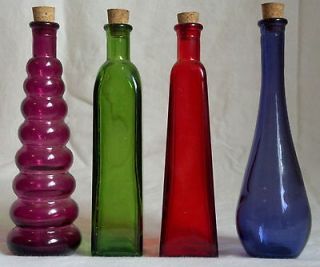Decorative set of 4 colored glass jars/bottles with cork pink,green 