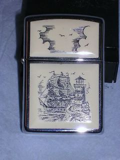 zippo lighter featuring a scrimshaw ship unused in box time
