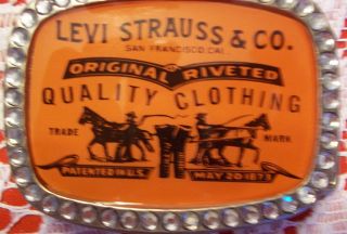 Levi Strauss & Co. belt buckle.plastic front with glass beads around 