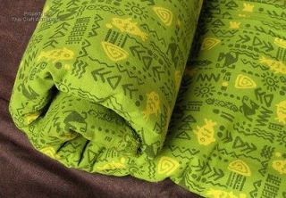 thai muang cotton fabric with aztec fish print on green