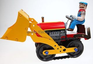 classic tin toy collectable man on bulldozer apx 21cm from