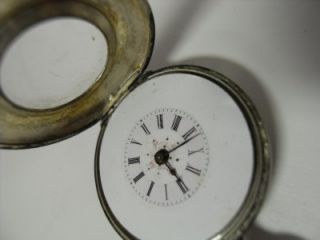 The mark of the watch manufacturer, ADOLPHE HUGUENIN and the style 