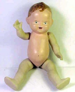this is an antique german china baby doll the doll depicts a baby boy 