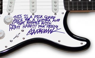 Autographed in person by Andrew W.K., who added THIS IS A PICK GUARD 