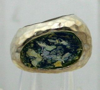   wonderful ring done with a large piece of ancient roman glass set in a