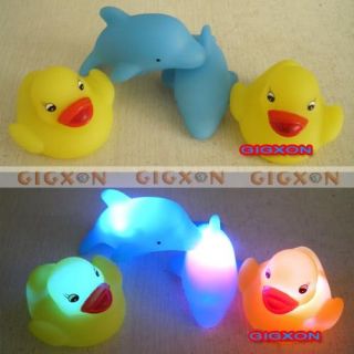 Baby Bath Fun LED Flashing Duck Dolphin Toy Rubber Light It Up Touch 
