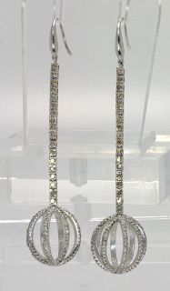   an awesome pair of diamond and 14k white gold earrings measuring 2 3
