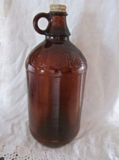 Up for auction is an old amber color Clorox bottle with metal cap. Not 