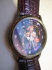 Love Lucy, round faced watch w/ metallic purple, reptile look 