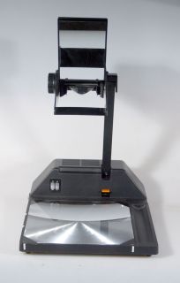 BELL AND HOWELL TRAVELLER OVERHEAD PROJECTOR.THE LIGHT AND FAN TURNED 