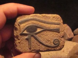 Egyptian Art   Eye of Horus and Ankh amulet. Ancient Egypt carving 