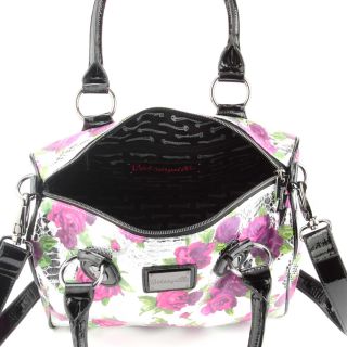 This Betseyville Rosey Days Satchel  overlays a floral print with 