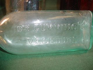 ONE LARGE 9 TALL ROUNDED CLEAR BOTTLEWITH LABEL FROM BRIMHALL BROS 