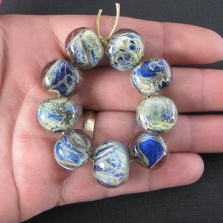  beads and one round bead, made by me, Deborah Smith, in my studio