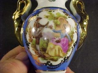 This is a cute little vase. It is a Goudenville Limoges 5 Vase, blue