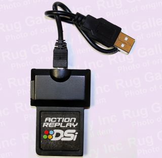 Nintendo DSi XL Bronze Handheld System Plus Action Replay DSi Game