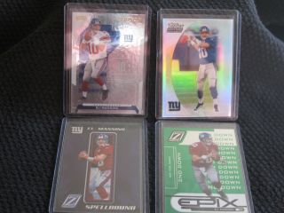 THESE ELI MANNING CARDS ARE IN MINT TO GEM MINT CONDITION BECAUSE THEY