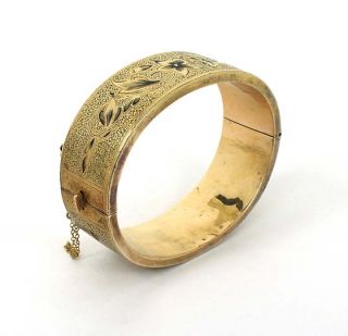  is a victorian 14k gold and enamel floral bangle bracelet the piece