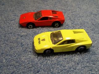Lot of 2 Hot Wheels Ferraris 1977 Red 1986 Neon Yellow