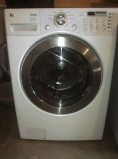 Front Load White LG Tromm Washer and Dryer. Pedestals not included