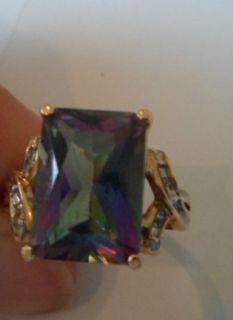 10k yellow ring with large mystic topaz with very small diamond