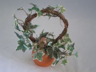 Small Artificial Ivy Decorated Grape Vine Wreath in a Terra Cotta Pot