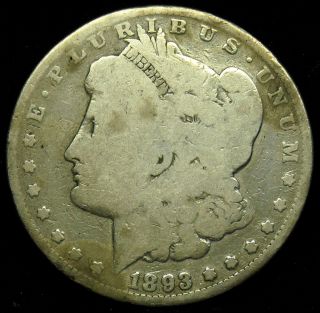 1893 Silver Morgan Dollar with Rim Dings and Spots Cleaned Grading