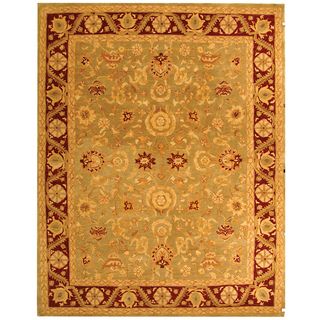 Handmade Kashan Green/ Red Wool Rug (96 X 136) (GreenPattern OrientalMeasures 0.625 inch thickTip We recommend the use of a non skid pad to keep the rug in place on smooth surfaces.All rug sizes are approximate. Due to the difference of monitor colors, 