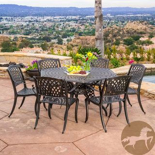 Christopher Knight Home Hallandale Newcastle 7 piece Cast Aluminum Bronze Outdoor Dining Set (BronzeFeatures mesh chairs and table topTable features lazy susan and umbrella openingSome assembly requiredSturdy constructionNeutral colors to match any outdoo
