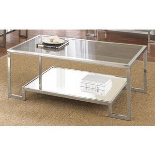 Cordele Chrome And Glass Coffee Table (Chrome, tempered glassQuantity One (1) coffee tableShiny chrome finished frame with 5mm tempered smoked glass insertsContemporary designRaised, base perfect for displaying decorative itemsFloor glides to help protec