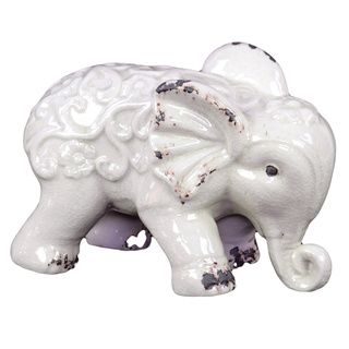 White Ceramic Elephant (WhiteDimensions 7 inches high x 10.5 inches wide x 6 inches deep CeramicColor WhiteDimensions 7 inches high x 10.5 inches wide x 6 inches deep)